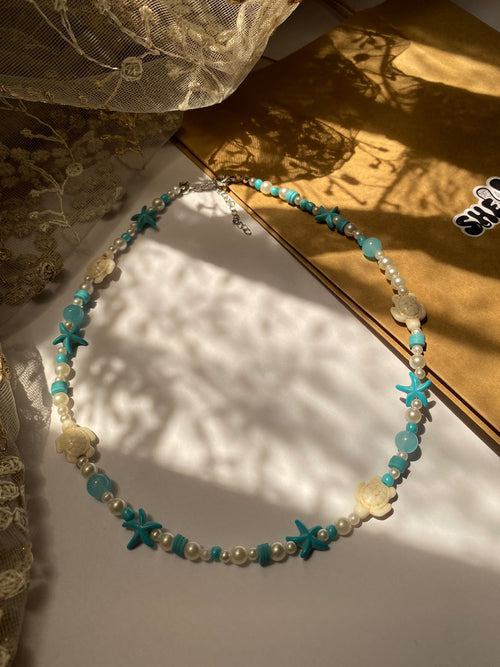 Handmade blue and white beaded turtle necklace with starfish by Shelluxe - Summer beach accessories